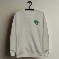 PJ green feet embroidered on a sweatshirt