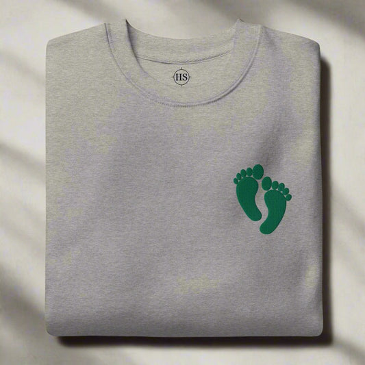 PJ green feet embroidered on a sweatshirt