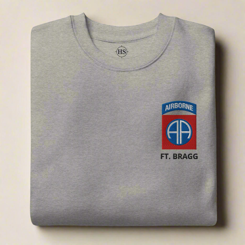 sweatshirt embroidered with 82nd airborne division insignia and ft. bragg lettering below it.
