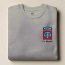 sweatshirt embroidered with 82nd airborne division insignia and ft. bragg lettering below it.