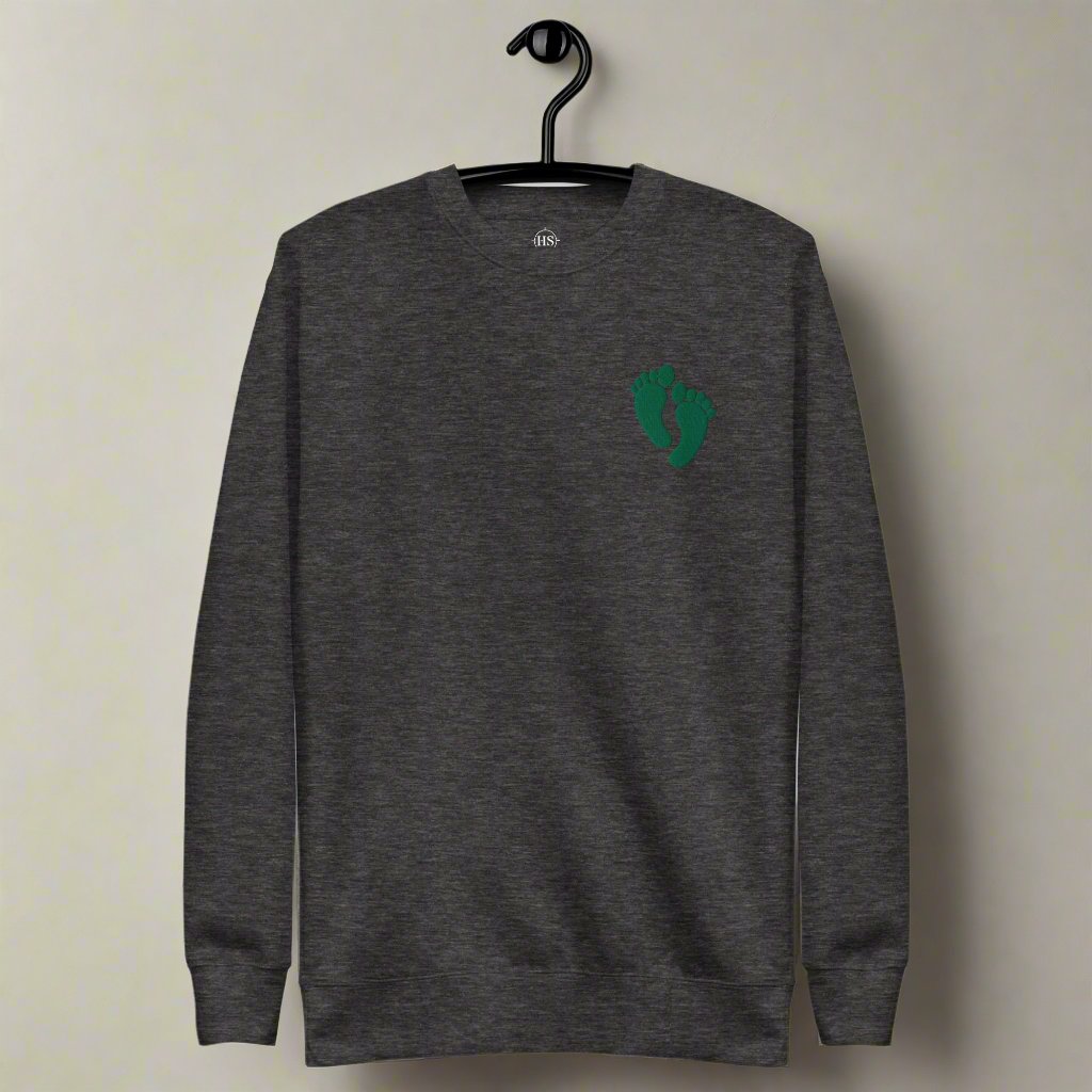 PJ green feet embroidered on a sweatshirt