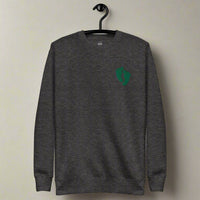 PJ green feet embroidered on a sweatshirt