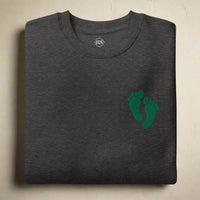 PJ green feet embroidered on a sweatshirt