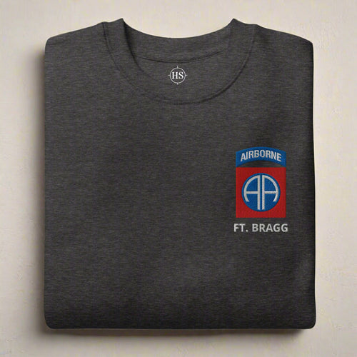 Sweatshirt embroidered with 82nd airborne division insignia with ft. bragg lettering below it. 