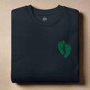PJ green feet embroidered on a sweatshirt